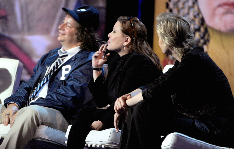 Carrie Fisher inimitably smoking a Blu e-cig for the entirety of Roseanne Barr’s Comedy Central Roast, 2012. Image via Getty
